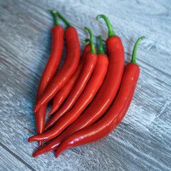  red hot chilli pepper on wooden table