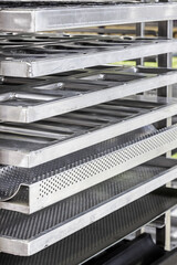 empty metal molds, trays and racks for baking bread and bakery products