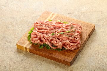 Raw minced pork meat over board