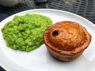 Traditional pub grub of pie and peas