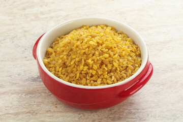 Raw bulgur in the bowl