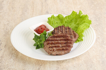 Grilled beef burger cutlet with sauce