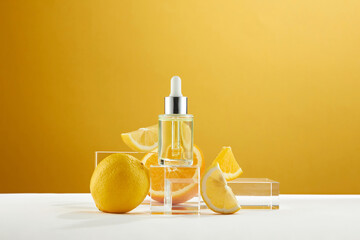 A front view of lemon decorated with cosmetic jar and transparent podium in orange background  - obrazy, fototapety, plakaty