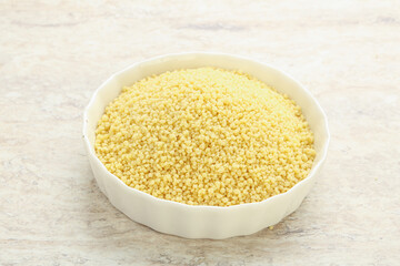 Raw couscous in the bowl