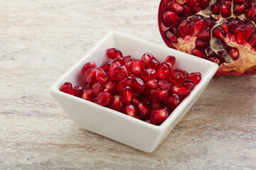 Ripe red Pomegranate seeds in the bowl