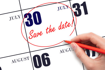 Hand drawing red line and writing the text Save the date on calendar date July 30.