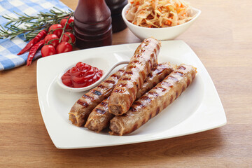 Grilled sausages with cabbage and sauce