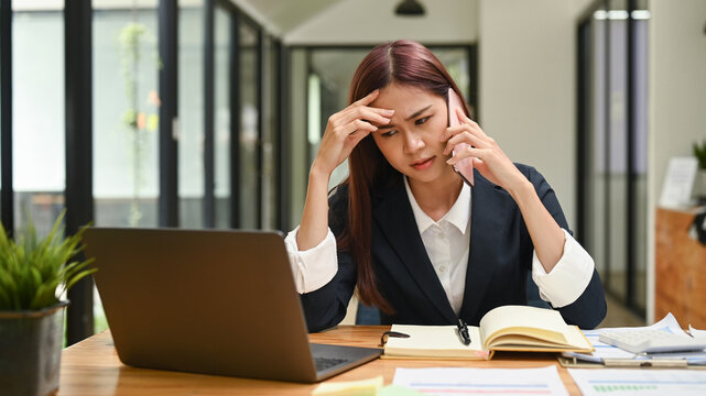 Young Female Employee Having Serious Conversation On Smartphone, Arguing With Client, Solve Business Problem