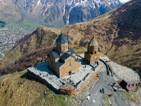 A stunning aerial view of Holy Trinity Church (Gergeti Trinity Church) near the village of Stepantsminda in Georgia