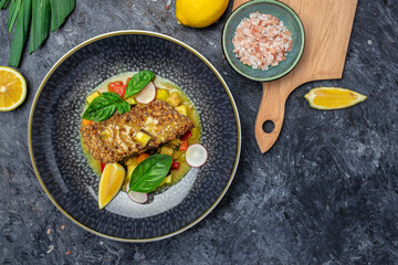 fish fillet breaded in nuts with pepper sauce and vegetables, Healthy fats, clean eating for weight loss, Ketogenic diet food. Restaurant menu, dieting, cookbook recipe top view