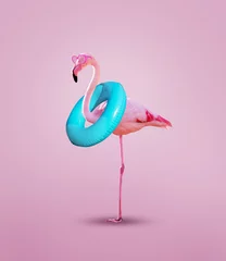 Poster Pink flamingo with inflatable buoy wear rosy glasses © Sergey Novikov