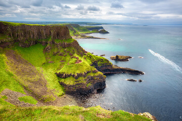 The Amphitheatre, Port Reostan Bay and Giant's Causeway on background, County Antrim, Northern...