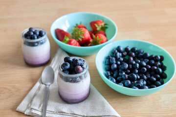 Yogurt with cranberries and strawberries, healthy food concept