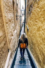 Woman in the narrowest street of Stockholm