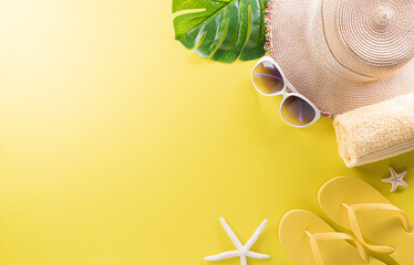 Summer composition concept made from starfish, beach hat, flip flop and monstera leaf on pastel...