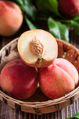 Fresh peach fruit with slices on wooden table
