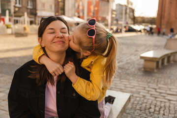 Fototapeta premium Close up view of cute mom and her young daughter 