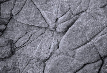 Eine Steintextur eines Felsen der einen vulkanischen Ursprung hat.