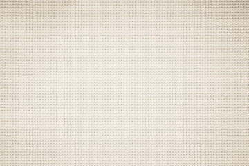 Fabric canvas woven texture background in pattern in light beige cream brown color gauze linen blank.