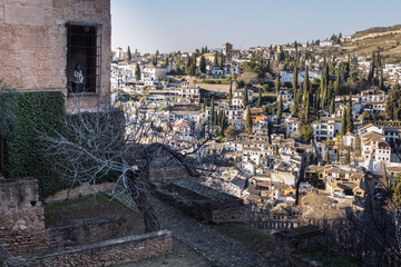Obraz premium ruins of an house in the village, person looks through the window in Granada 