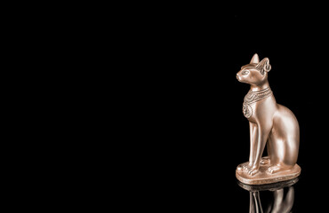 Egyptian cat statue isolated on black background