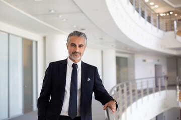 Portrait of Middle Eastern businessman in a modern corporate office atrium