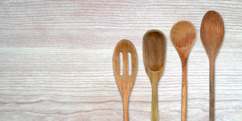Topview of Set Cooking Wooden Utensils on Table Background