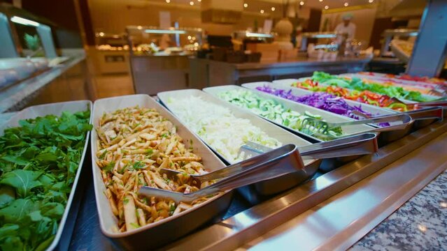 Salad, vegetables bar on self-service luxury hotel in Tunisia. All-you-can-eat buffet during lunch, dinner time. Choose dishes. Resort restaurant. All inclusive. Buffet food. Self-service restaurant. 