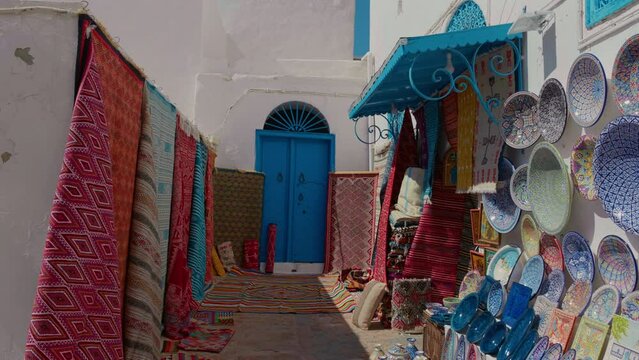Multicolor Souvenir earthenware and carpets in tunisian market, Sidi Bou Said, Tunisia.
