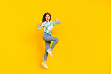 Fototapeta na wymiar Full size photo of cheerful attractive charming girl show thumb-up promote product isolated on yellow color background