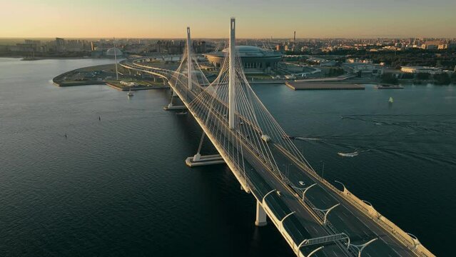 Sunset, flight over the cable-stayed bridge of the motorway, over the Neva River in St. Petersburg