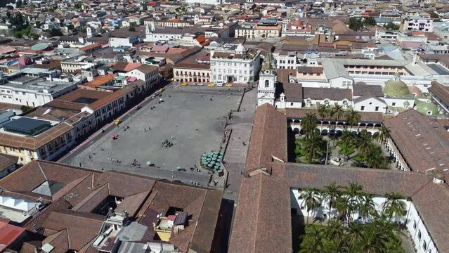 Quito, Ecuador: Aerial drone footage of the famous Quito colonial historic district with the San Francisco square and basilica with the  El Panecillo hill and statue.  Shot with a tilt up motion. 