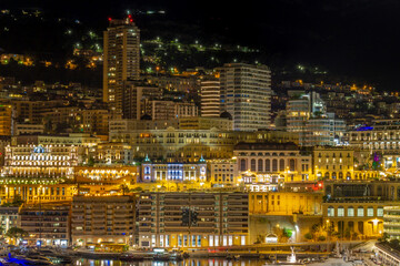 Fototapeta na wymiar Monaco principality at night, luxury yachts at Port Hercules waterfront