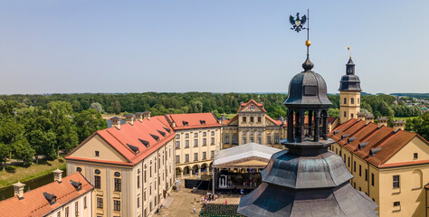 Fototapeta premium Aerial view of spire of the castle tower of Nesvizh Castle, Belarus. Medieval castle and palace. Heritage concepts.