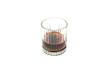 Whiskey or scotch with whiskey stones on white background, selective focus. Old fashion glass, copy space