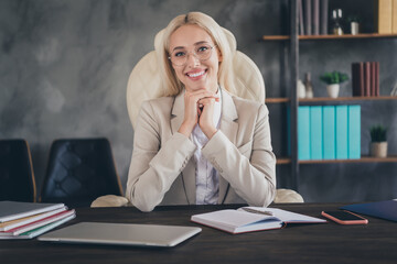Portrait of cheerful charming person sitting chair toothy smile look camera workplace office indoors