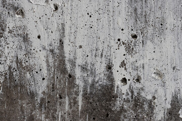 Texture of old concrete wall. Rough gray concrete surface with white spots. Perfect for background and design. Closeup. High resolution.