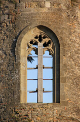 Fototapeta na wymiar Stabilizing wooden board as a monument protection measure at a collapse threatened gothic window in the Carcassonne city wall in France