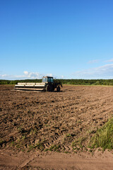 Fototapeta premium tractor working in the field