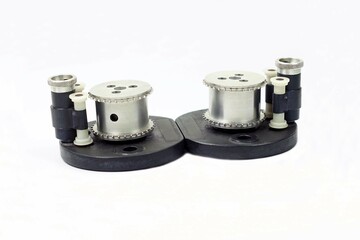 A vintage sprockets drive of a film 35mm camera on white backgrounds.