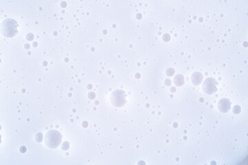 Bubble white background texture. Gel for cleansing the skin of the face and body. Spa treatments, skin care. Bath foam, detergent. Slime