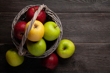 Colorful ripe apple fruits in basket