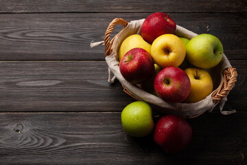 Colorful ripe apple fruits in basket