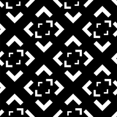 Fototapeta premium Vector. Black and white abstract ethnic seamless pattern. Background of angle brackets. Mosaic. Design of packaging paper, textile printing, web design, cover, advertising and typographic products.