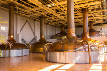 Brewery. Tanks for brewing beer. Industrial work, automated modern food and drink production in...