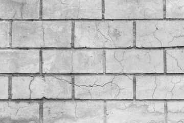 Old dirty white cracked brick texture wall damaged background broken