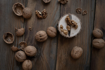 Fototapeta na wymiar walnuts on wooden background