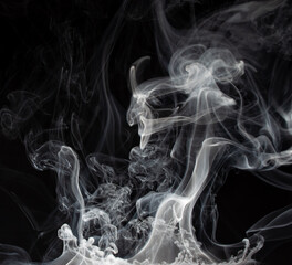 Abstract smoke on a dark background . Isolated .