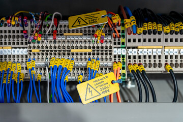 Electric wiring diagram of machinery in industrial factory. Terminal diagram with tag and warning...