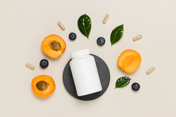 Top view mockup bottle of multivitamins and pills with fresh fruits, bio supplement for good vision
